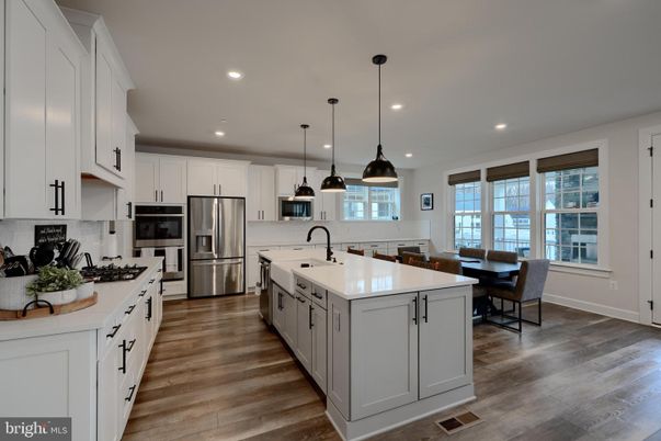 Dining room, Interior, Kitchen, Pendant Lights, Recessed Lighting, Stainless Steel Appliances, Wood Texture Flooring