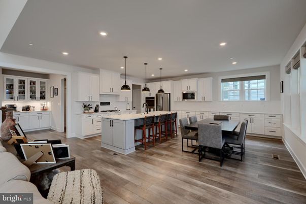 Dining room, Interior, Kitchen, Pendant Lights, Recessed Lighting, Stainless Steel Appliances, Wood Texture Flooring