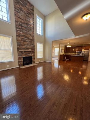 Empty room, Fireplace, Interior, Kitchen, Pendant Lights, Stone Walls, Wood Texture Flooring