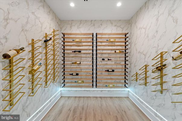 Interior, Marble Walls, Recessed Lighting, Wine Storage, Wood Texture Flooring