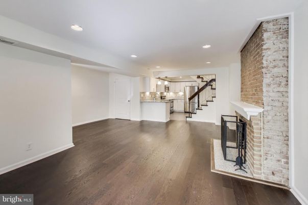Empty room, Fireplace, Interior, Kitchen, Recessed Lighting, Stone Walls, Wood Texture Flooring