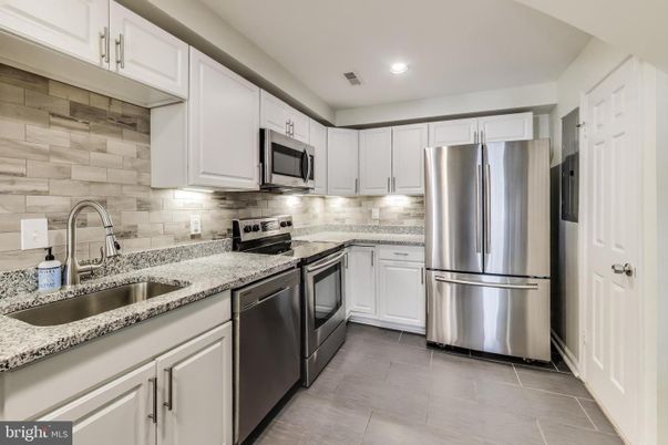 Interior, Kitchen, Recessed Lighting, Stainless Steel Appliances, Stone Walls