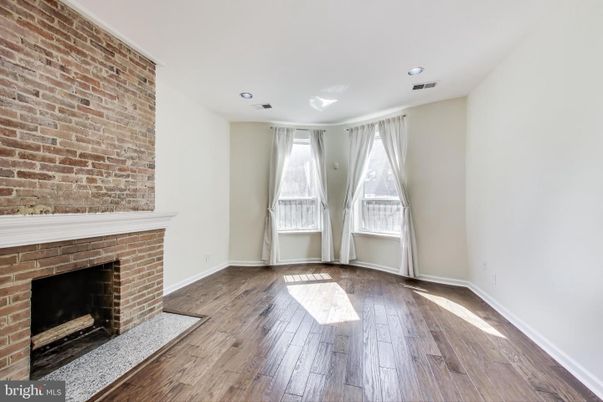 Empty room, Fireplace, Interior, Recessed Lighting, Stone Walls, Wood Texture Flooring