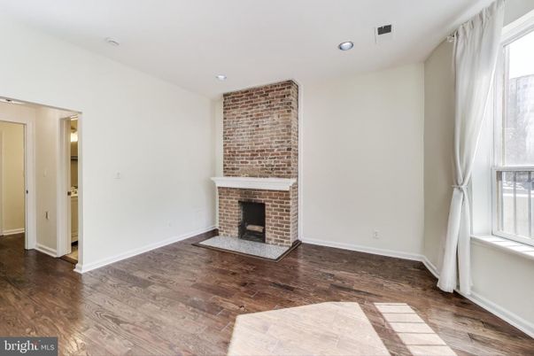 Empty room, Fireplace, Interior, Recessed Lighting, Stone Walls, Wood Texture Flooring