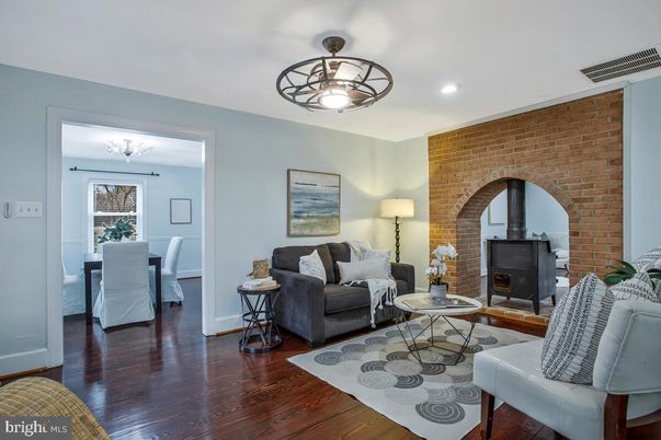 Dining room, Fireplace, Interior, Living room, Recessed Lighting, Stone Walls, Wood Texture Flooring