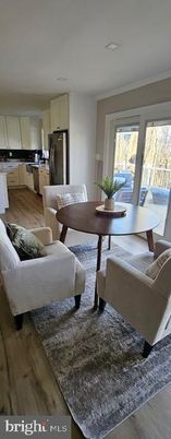 Dining room, Interior, Kitchen, Living room, Recessed Lighting, Stainless Steel Appliances, Wood Texture Flooring