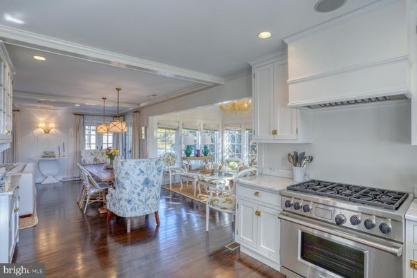 Chandelier, Dining room, Interior, Kitchen, Pendant Lights, Recessed Lighting, Stainless Steel Appliances, Wood Texture Flooring