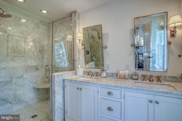 Bathroom, Dual Sink Vanities, Glass Shower, Interior, Marble Walls, Recessed Lighting