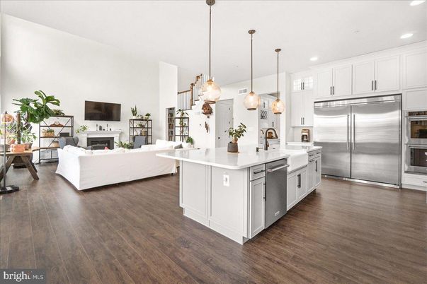 Fireplace, Interior, Kitchen, Living room, Pendant Lights, Recessed Lighting, Stainless Steel Appliances, Wood Texture Flooring