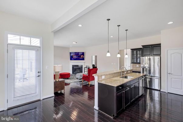 Dining room, Fireplace, Interior, Kitchen, Living room, Pendant Lights, Recessed Lighting, Stainless Steel Appliances, Wood Texture Flooring