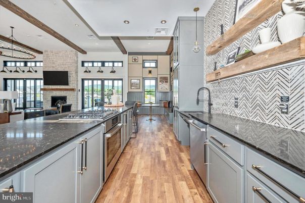 Fireplace, Interior, Kitchen, Pendant Lights, Recessed Lighting, Stainless Steel Appliances, Stone Walls, Wooden Beams, Wood Texture Flooring