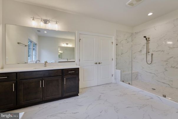 Bathroom, Dual Sink Vanities, Glass Shower, Interior, Marble, Marble Walls, Recessed Lighting