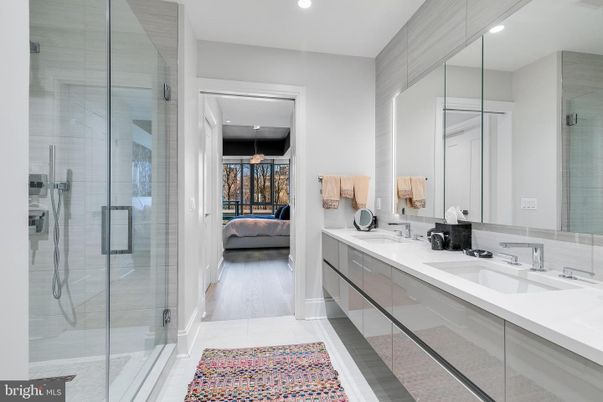 Bathroom, Dual Sink Vanities, Glass Shower, Interior, Recessed Lighting, Wood Texture Flooring