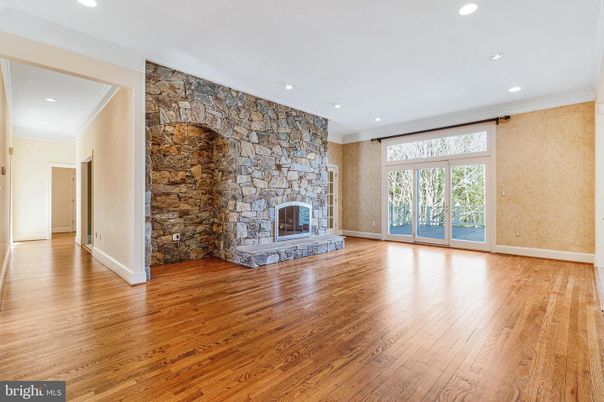 Empty room, Fireplace, Interior, Recessed Lighting, Stone Walls, Wood Texture Flooring