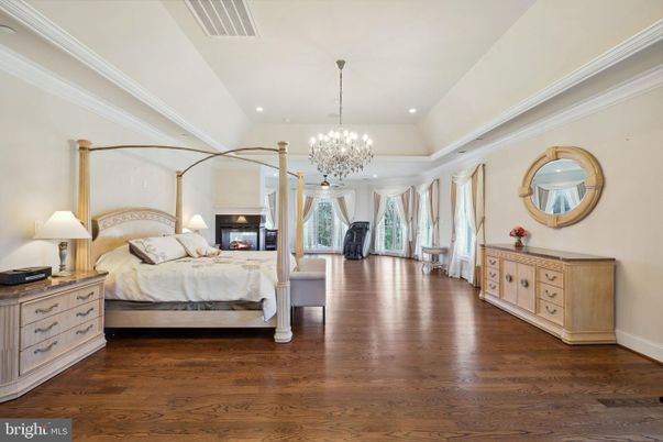 Bedroom, Chandelier, Fireplace, Interior, Recessed Lighting, Wood Texture Flooring
