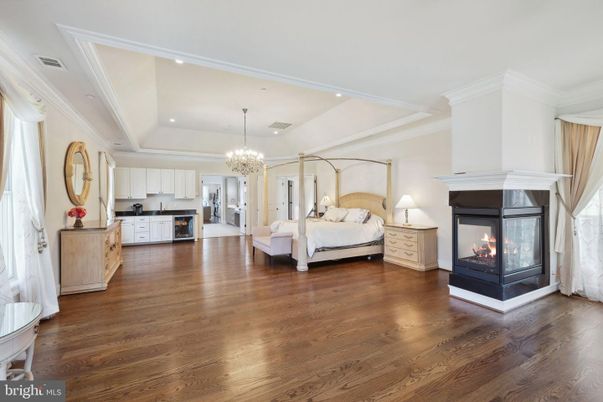 Bedroom, Chandelier, Fireplace, Interior, Recessed Lighting, Wood Texture Flooring