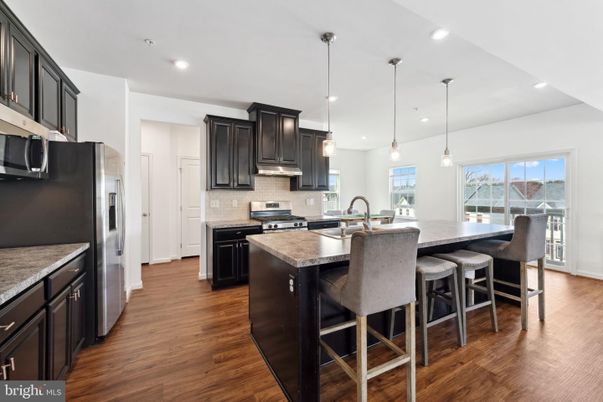 Dining room, Interior, Kitchen, Pendant Lights, Recessed Lighting, Stainless Steel Appliances, Wood Texture Flooring