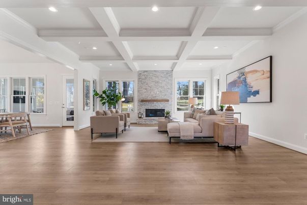 Dining room, Fireplace, Interior, Living room, Recessed Lighting, Stone Walls, Wood Texture Flooring