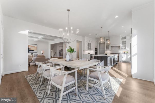 Chandelier, Dining room, Interior, Kitchen, Living room, Pendant Lights, Recessed Lighting, Stainless Steel Appliances, Wood Texture Flooring