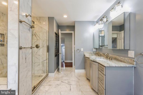 Bathroom, Dual Sink Vanities, Glass Shower, Interior, Marble, Marble Walls, Recessed Lighting