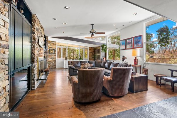 Fireplace, Interior, Living room, Recessed Lighting, Stone Walls, Wood Texture Flooring
