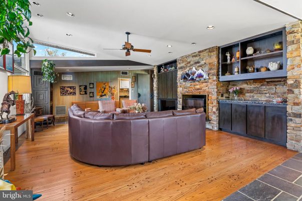 Fireplace, Interior, Living room, Recessed Lighting, Stone Walls, Wood Texture Flooring, Wooden Walls