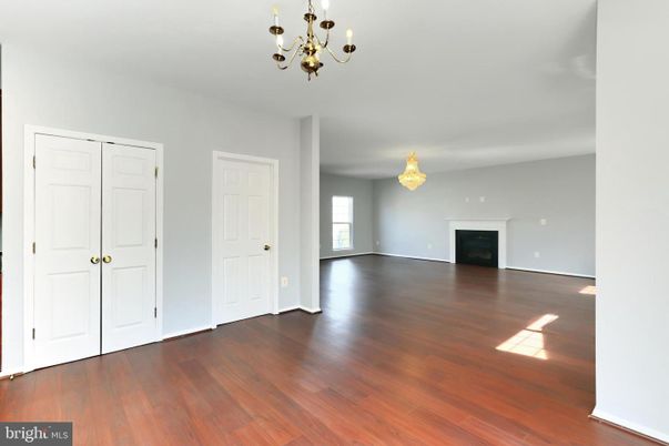 Chandelier, Empty room, Fireplace, Interior, Wood Texture Flooring