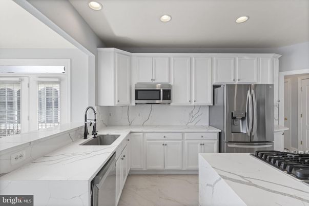 Interior, Kitchen, Marble, Marble Walls, Recessed Lighting, Stainless Steel Appliances