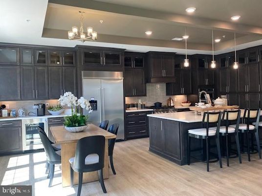 Chandelier, Dining room, Interior, Kitchen, Pendant Lights, Recessed Lighting, Stainless Steel Appliances, Wood Texture Flooring