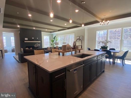 Chandelier, Dining room, Interior, Kitchen, Living room, Pendant Lights, Recessed Lighting, Stainless Steel Appliances, Wood Texture Flooring