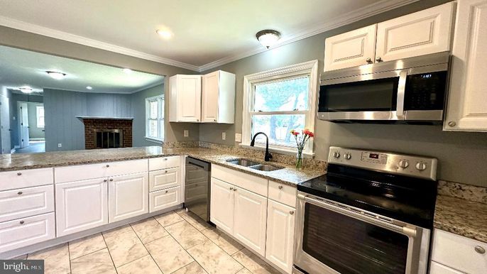 Fireplace, Interior, Kitchen, Recessed Lighting, Stainless Steel Appliances