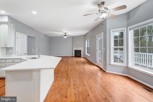 Empty room, Fireplace, Interior, Kitchen, Recessed Lighting, Wood Texture Flooring