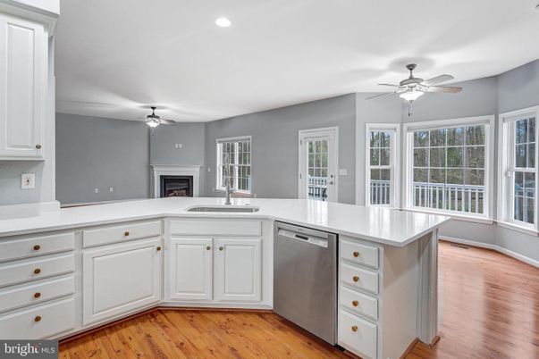 Fireplace, Interior, Kitchen, Recessed Lighting, Wood Texture Flooring