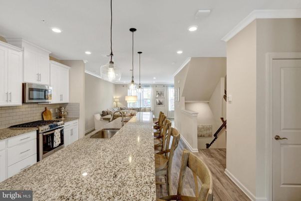 Dining room, Interior, Kitchen, Pendant Lights, Recessed Lighting, Stainless Steel Appliances, Wood Texture Flooring