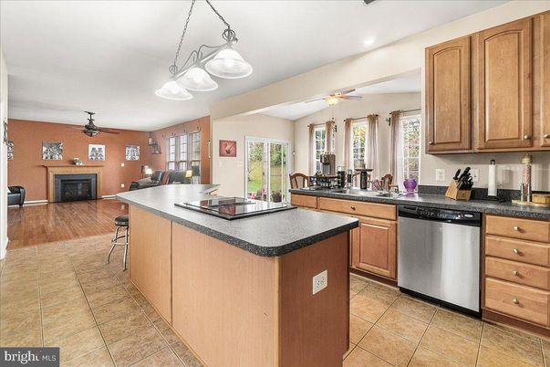 Dining room, Fireplace, Interior, Kitchen, Living room, Pendant Lights, Recessed Lighting, Stainless Steel Appliances, Wood Texture Flooring