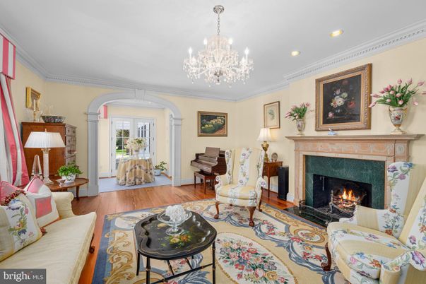 Chandelier, Fireplace, Interior, Living room, Piano, Recessed Lighting, Wood Texture Flooring