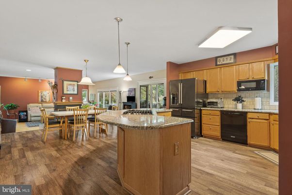 Dining room, Interior, Kitchen, Pendant Lights, Recessed Lighting, Stainless Steel Appliances, Wood Texture Flooring