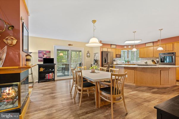 Dining room, Fireplace, Interior, Kitchen, Pendant Lights, Wood Texture Flooring