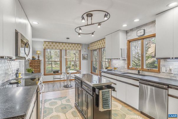 Dining room, Interior, Kitchen, Recessed Lighting, Stainless Steel Appliances, Wood Texture Flooring