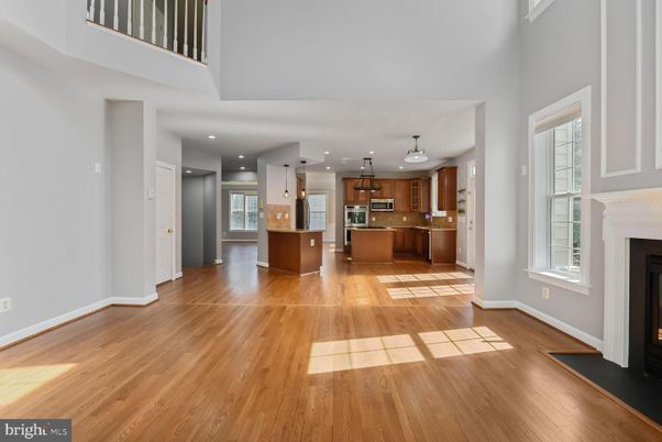 Fireplace, Interior, Kitchen, Pendant Lights, Recessed Lighting, Stainless Steel Appliances, Wood Texture Flooring