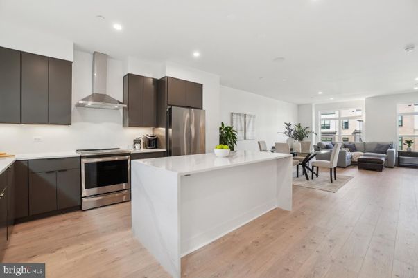 Dining room, Interior, Kitchen, Living room, Recessed Lighting, Stainless Steel Appliances, Wood Texture Flooring