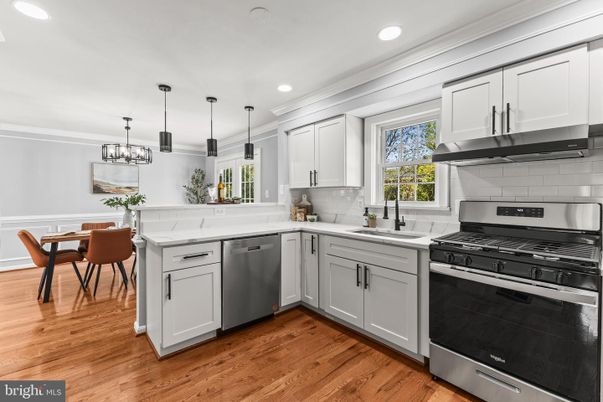 Dining room, Interior, Kitchen, Pendant Lights, Recessed Lighting, Stainless Steel Appliances, Wood Texture Flooring