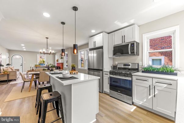 Chandelier, Dining room, Interior, Kitchen, Living room, Pendant Lights, Recessed Lighting, Stainless Steel Appliances, Wood Texture Flooring