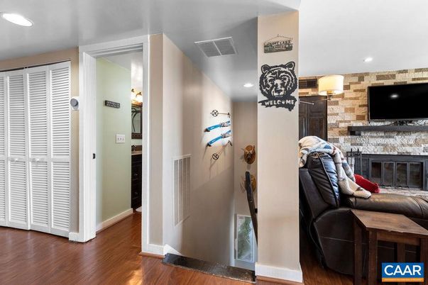 Fireplace, Interior, Recessed Lighting, Stone Walls, Wood Texture Flooring