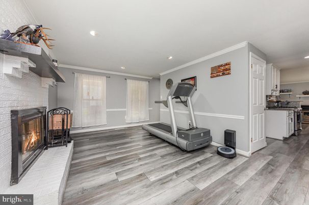 Fireplace, Fitness Equipment, Interior, Recessed Lighting, Wood Texture Flooring