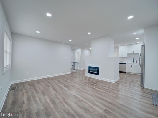Empty room, Fireplace, Interior, Kitchen, Recessed Lighting, Wood Texture Flooring