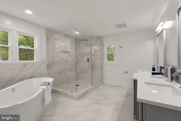 Bathroom, Dual Sink Vanities, Free Standing Baths, Glass Shower, Interior, Marble, Marble Walls, Recessed Lighting