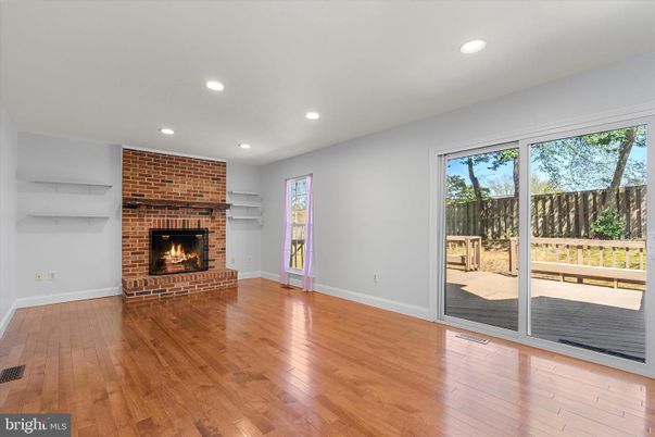 Empty room, Fireplace, Interior, Recessed Lighting, Stone Walls, Wood Texture Flooring