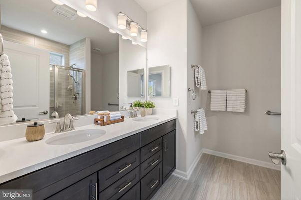 Bathroom, Dual Sink Vanities, Glass Shower, Interior, Recessed Lighting, Wood Texture Flooring