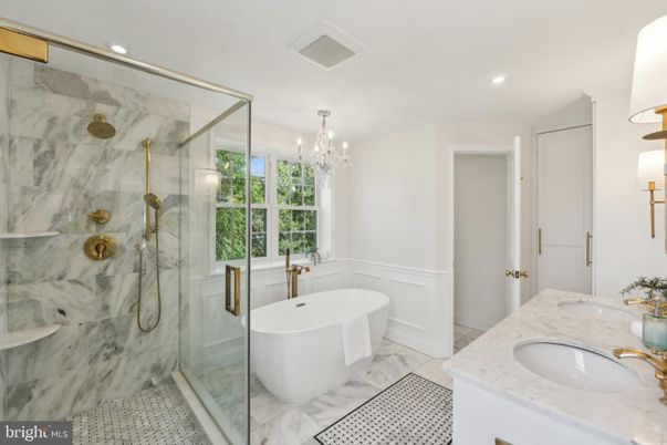 Bathroom, Chandelier, Dual Sink Vanities, Free Standing Baths, Glass Shower, Interior, Marble, Marble Walls, Recessed Lighting